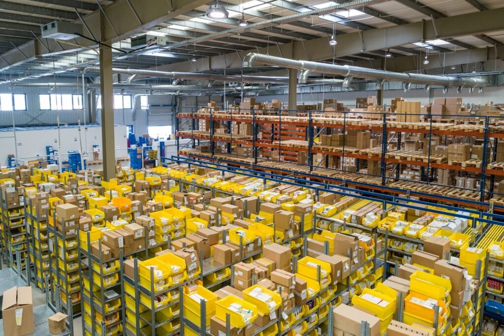 Warehouse shelving stocked with goods (illustrative stock photo)